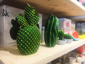 cactus candles on shelf