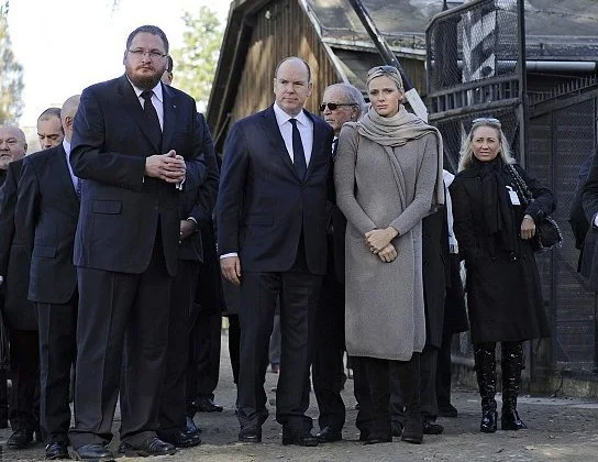 Prince Albert and Princess Charlene have visited the memorial of the former Nazi German death camp of Auschwitz-Birkenau and laid flowers at its Execution Wall