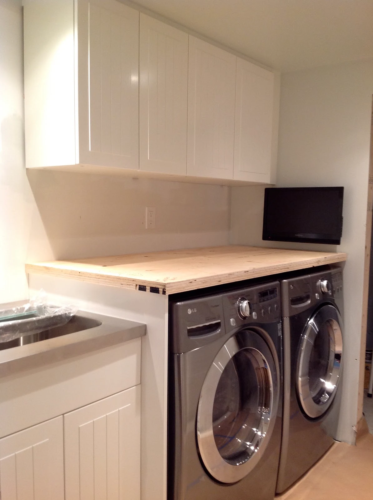 counter over front load washer and dryer, How To Install A Countertop Over A Washer And Dryer, DIY floating countertop in the laundry room, countertop cleat, countertop gable