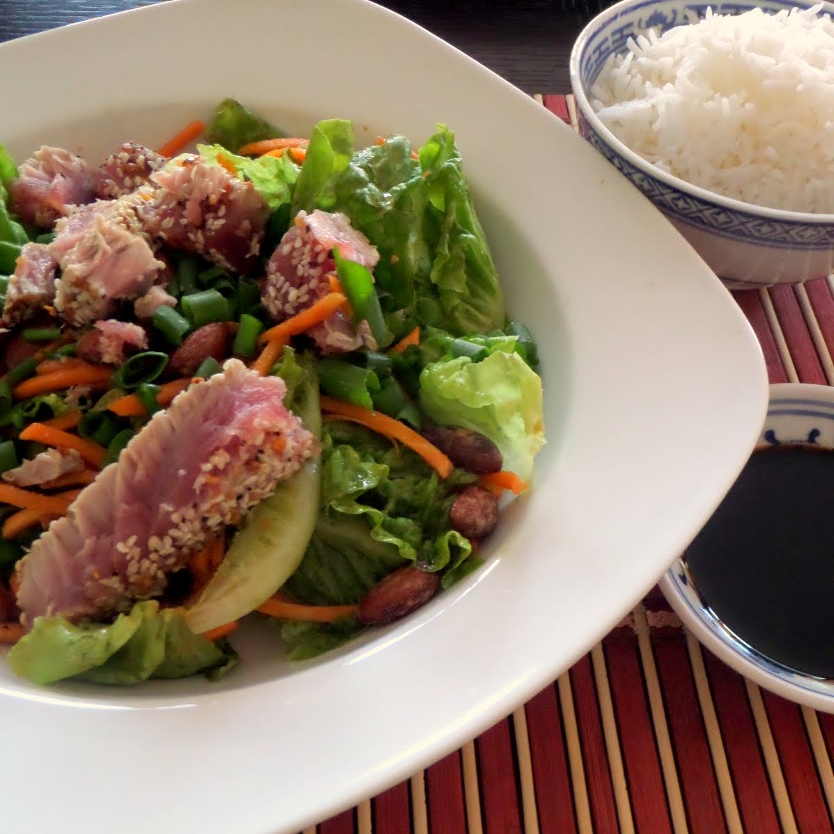 Seared Ahi Salad:  Strips of seared tuna steak atop a green salad tossed in an Asian vinaigrette