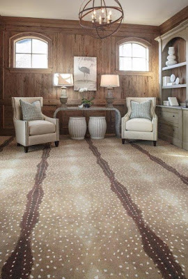 Bold patterned carpet adds a fun design element to this room