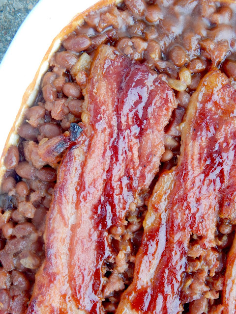 The BEST Potluck Baked Beans...these will be the hit of the party!  Sticky, salty and sweet this is the only way you'll want them from here on out! (sweetandsavoryfood.com)