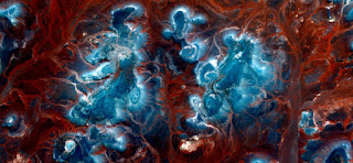 blue islands on orange red background sand,abstract landscapes of deserts of Africa ,Abstract Naturalism,abstract photography deserts of Africa from the air,abstract surrealism,mirage in Sahara desert blue islands on orange red background sand,abstract landscapes of deserts of Africa ,Abstract Naturalism,abstract photography deserts of Africa from the air,