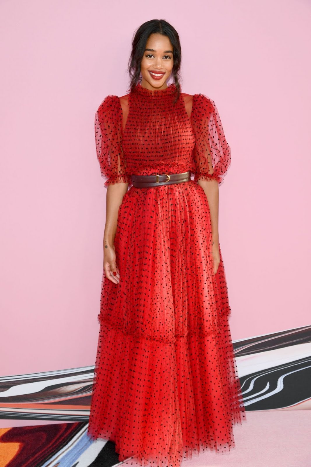 Hollywood black beauty Laura Harrier in red At CFDA Fashion Awards In