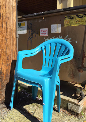 two blue plastic chairs