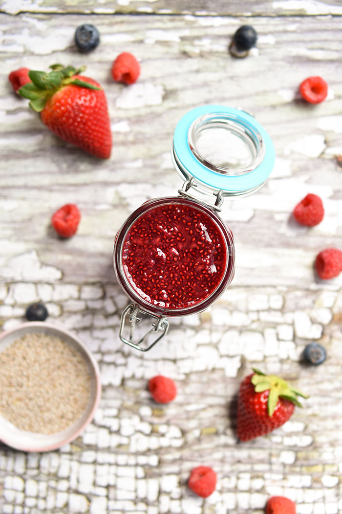 Fast and Easy Chia Berry Jam (vegan) - whip together this jam while making your morning oatmeal! Swirl it into oatmeal or coconut yogurt and spread it onto toast. Great when you only have frozen berries available. #vegan #dairyfree #jam #chiajam #chiaseeds #plantbased #veganrecipes