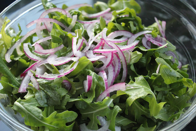 Simple arugula salad with red onion