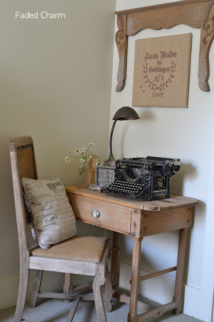 Faded Charm's desk and chair with a vintage typewriter