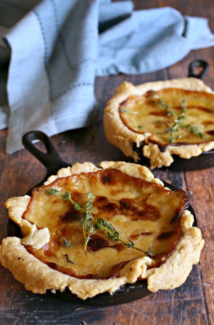 Recipe for cheesy sweet onion tarts in a buttery pastry crust.
