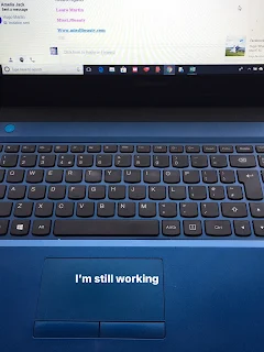 laptop open with I'm still working on the screen