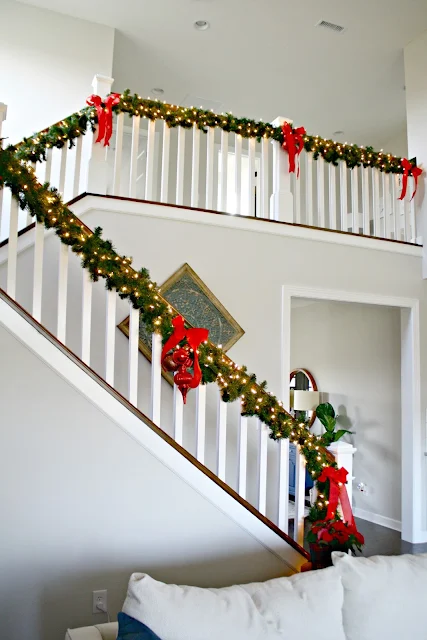 Greenery attached under stair railing