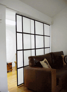 calming brown sofa on laminate floor plus japanese sliding door and white wall idea