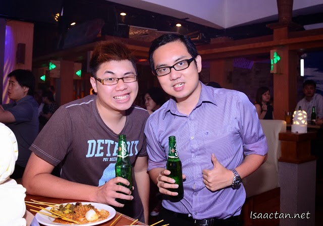 Ryan Mo and I enjoying our bottles of Carlsberg