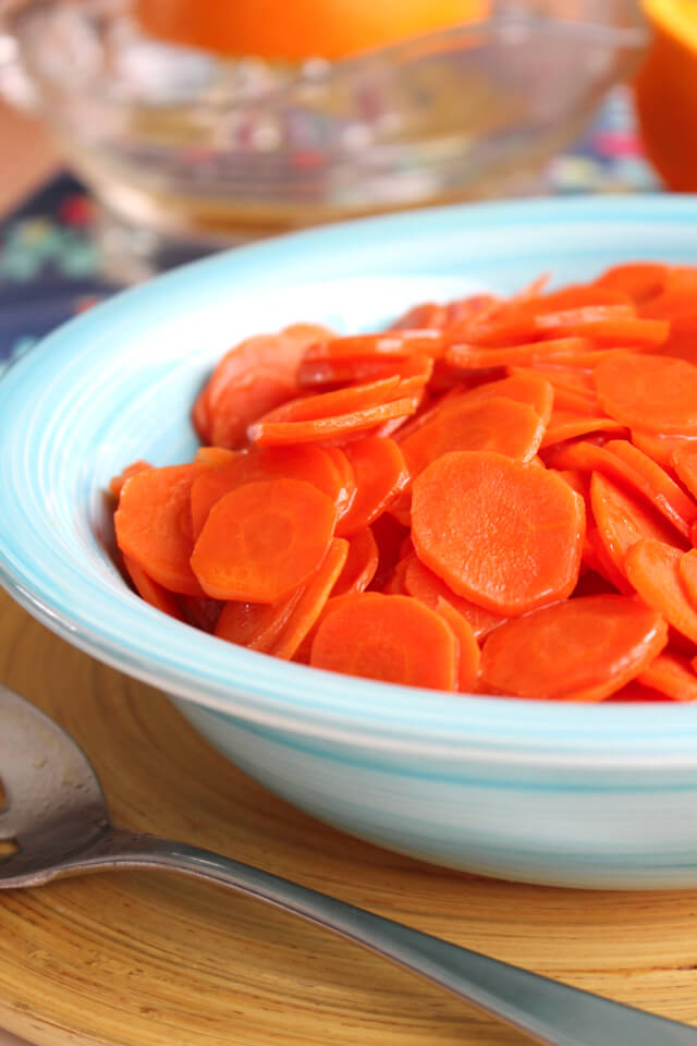 Maple Butter Carrots is an easy to make, four-ingredient, kid approved recipe featuring thinly sliced carrots in a sweet buttery sauce! #feastndevour