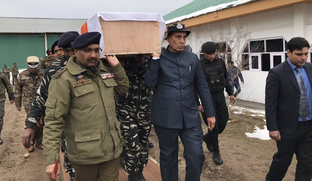 Arms lifted Martyr coffin is being carried by Union Home Minister