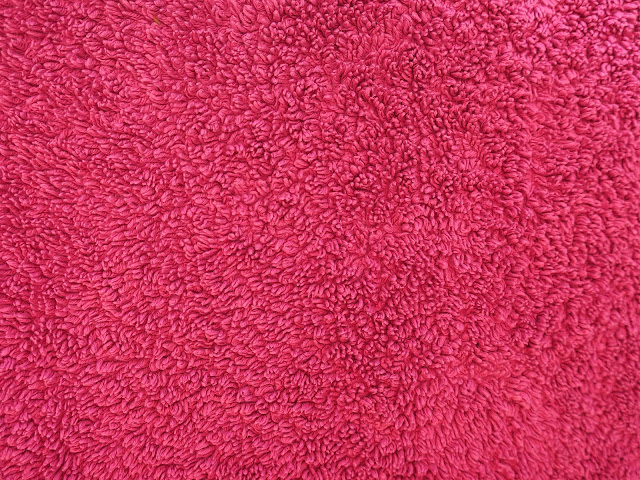 Red (ish) towel close to.