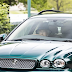 91 year old Queen Elizabeth II photographed driving a green Jaguar after Church services 
