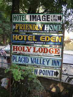 list of hotels in Pokhara posted on tree