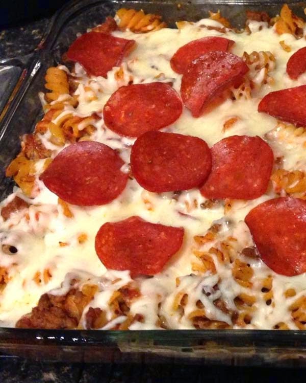 Pizza casserole made from rotini pasta and ground beef topped with mozzarella and turkey pepperoni. It's delicious and easy to make. Something to try when hosting a football game in your home.