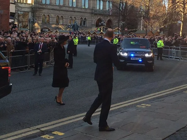 Kate Middleton wore the black Alexander McQueen coat, Gianvito Rossi pumps, Pretty Ballerinas Mascaro black velvet clutch