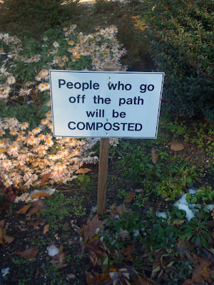 sign says: people who go off the path will be composted