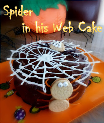 Spider in his Web Cake: cake, a web and a spider peeking through. Yup, it’s October! | Recipe developed by www.BakingInATornado.com | #Halloween #cake