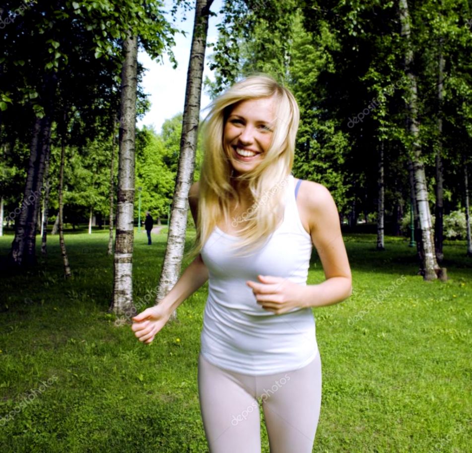 blonde cheerful cute girl doing yoga in park smiling in motion blonde cheerful cute girl doing yoga in park smiling in motion