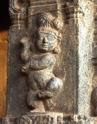 Dancing Baby Krishna, with his braided hair tied up in a divided bun. Jalakandeswarar Temple, Vellore, c.1550 CE