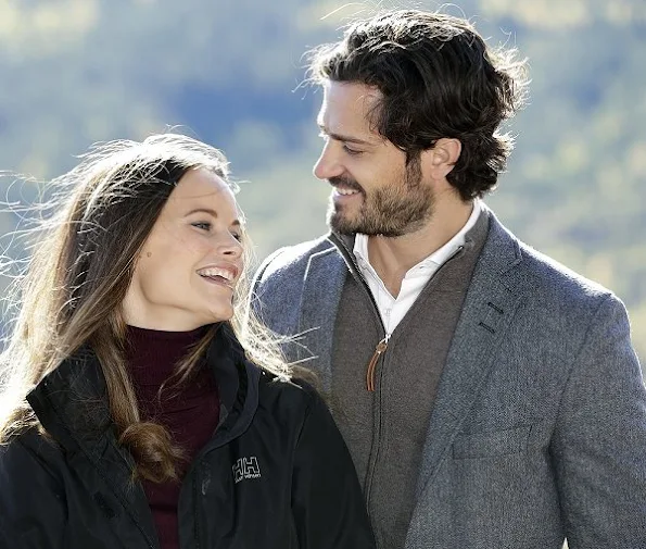 Prince Carl Philip and Sofia Hellqvist at opening of Hykjeberget Nature Reserve. Princess Sofia Hellqvist Style wore new sesion dress bag earring diamond, new sesion wool cardigan sweater coat