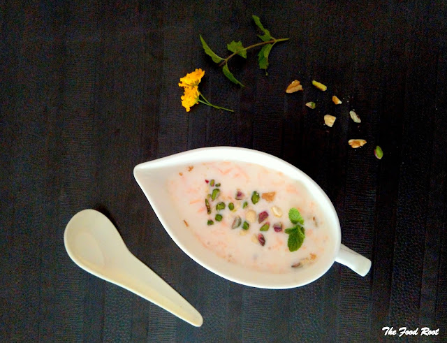 Carrot raita is a yogurt dip, prepared with grated raw carrot, yogurt and seasoned with mint, pistachios, chaat masala and served alongside Indian meals.
