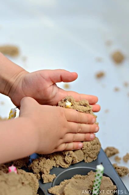 Preschooler playing with kinetic sand