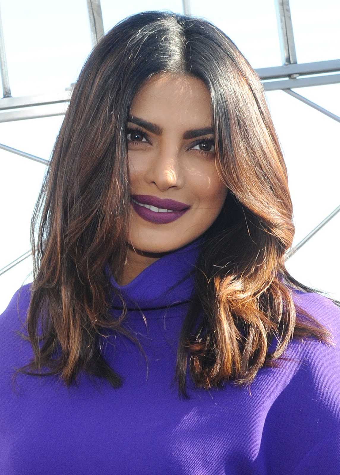 Priyanka Chopra Looks Sexy In a Purple Short Dress and Black Thigh High Boots During â€œQuanticoâ€ Promotion at The Empire State Building in New York City