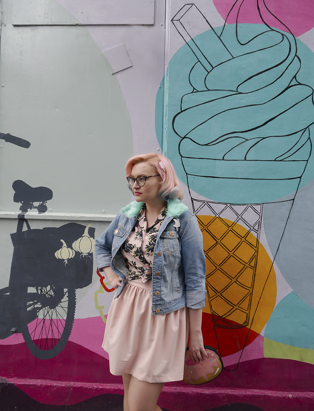 Giant icecream grafitti fashion shoot background foudn in Edinburgh Scottish fashion blogger Kimberley from Wardrobe Converations with candy coloured hair and DIY retro denim jacket standing against grafitti background with icecreams