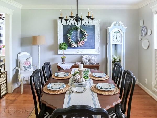 shabby farmhouse dining room with painted clock