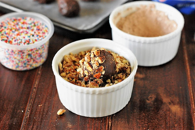 Rolling Homemade Chocolate Truffles in Chopped Pecans Image
