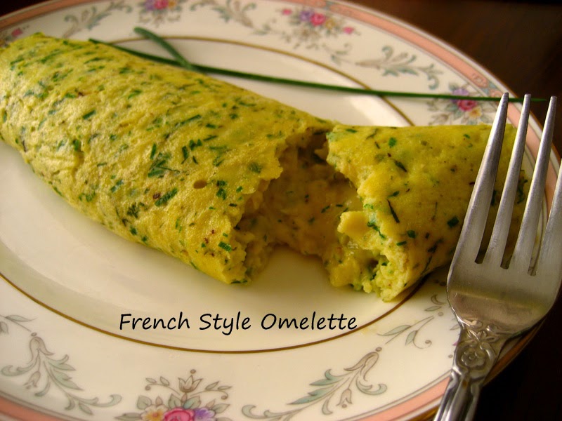 Home Cooking In Montana French Style Omelette... with herbs and cheese.