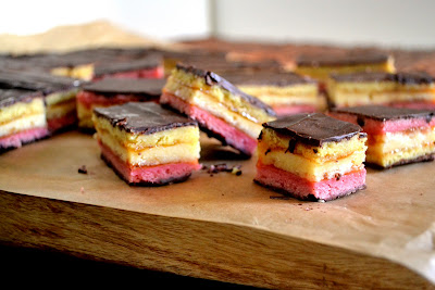 Classic Italian rainbow cookies, layered with almond cake, thin layer of apricot jam and coated with bittersweet chocolate.