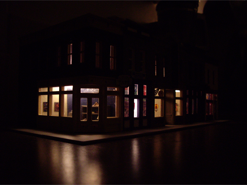 Completed Walthers Merchant’s Row I kit showing storefront interior lighting effects