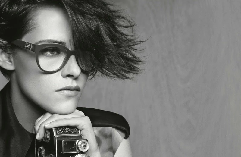 Kristen Stewart poses as a photojournalist for Chanel's Spring/Summer 2015 Eyewear Campaign