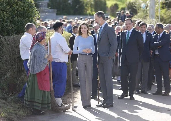 Queen Letizia wore Mango Prince of Wales trousers, Hugo Boss top, and Magrit suede pumps. Style of Letizia