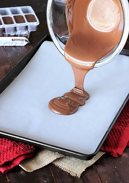 Pouring Melted Chocolate to Make Chocolate Chip Cookie Dough Bark Image