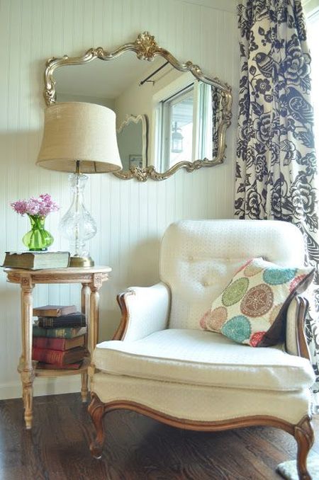 classic and elegant reading corner with big white armchair