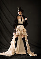 The high low hem skirt (or mullet dress or hi lo skirt) is popular in women's steampunk fashion, dervied from victorian era overdresses that were short in the front to show off layers of ruffled petticoats