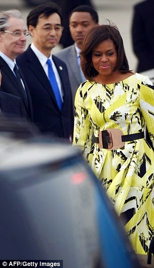 26C37CA100000578 3000239 image a 10 1426712898977 Michelle Obama stuns in floral Kenzo dress as she arrirves Japan