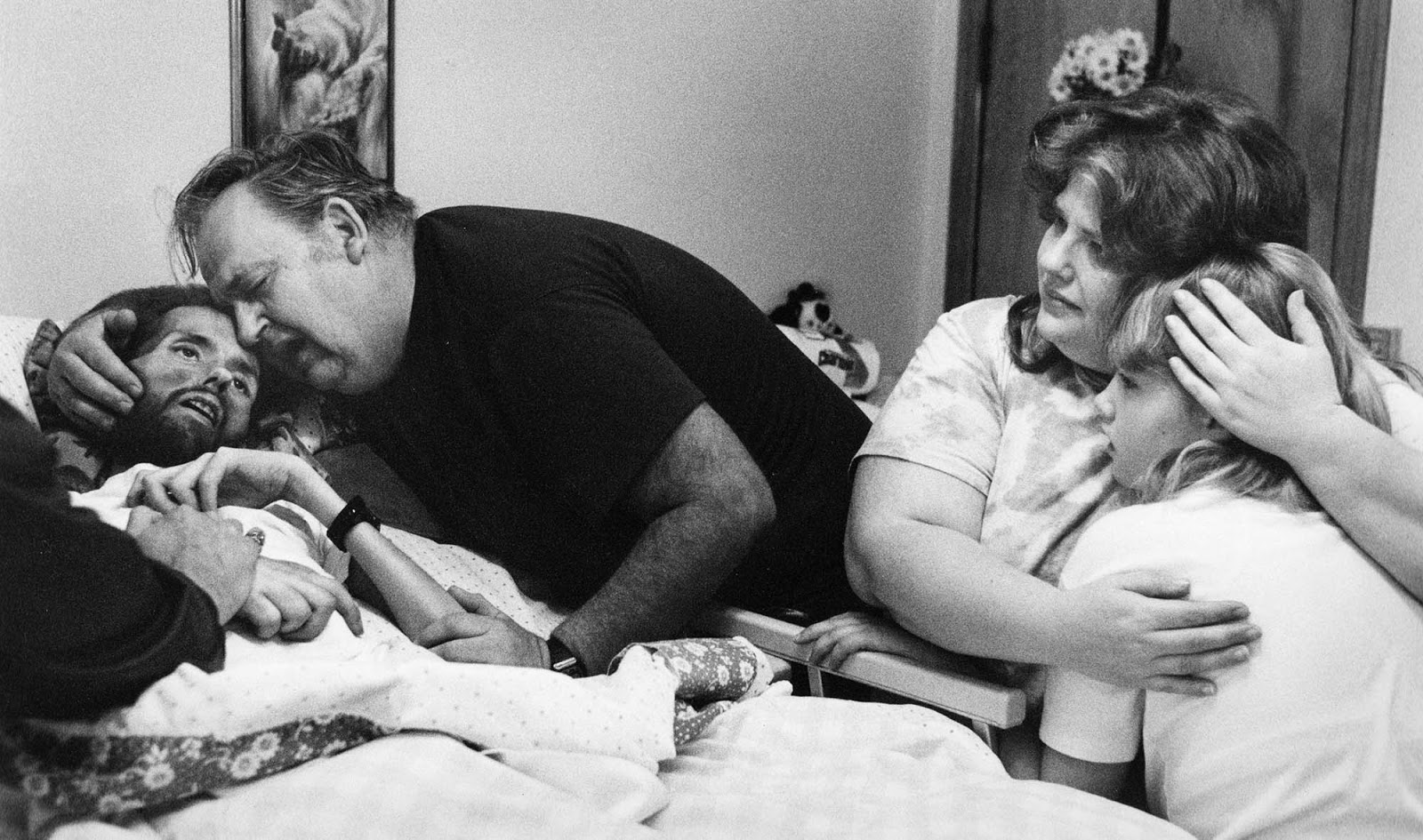 A father comforts his son, David Kirby, on his deathbed in Ohio, 1989. Widely considered the photo that changed the face of AIDS.