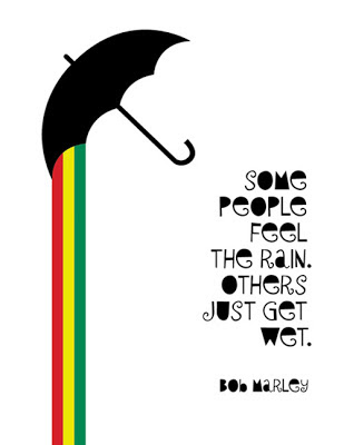 green, red, yellow rainbow flowing from umbrella, plus poster text