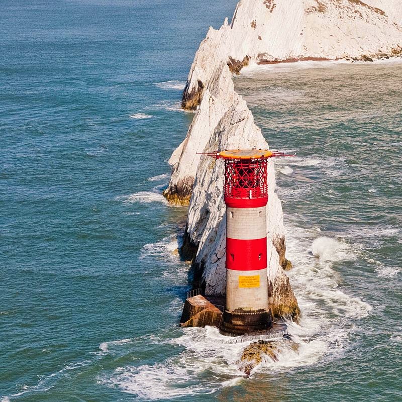 The Needles is a row of three distinctive stacks of chalk that rise out of the sea off the western extremity of the Isle of Wight, England, close to Alum Bay. The Needles lighthouse stands at the end of the formation. Built in 1859, it has been automated since 1994. 