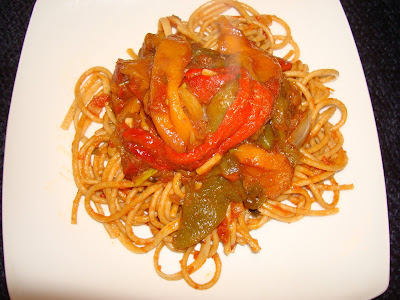 PORTIONS: 4 INGREDIENTS 8 oz. whole grain spaghetti ROASTED PEPERONATA SAUCE 1 tbsp. olive oil 2 chopped garlic cloves 1 small diced onion ¼ cup balsamic vinegar 1½ cup chopped plum tomatoes 1 tsp. salt ¼ tsp. red pepper flakes 1 red pepper 1 yellow pepper 1 orange pepper 1 green pepper 1 tbsp. chopped fresh basil leaves METHOD On top of the kitchen stove burn the peppers skin. Peel them and remove seeds. Cut them in long strips. Heat up a pot with the olive oil and sauté garlic and onions together. Add balsamic vinegar and reduce to half. Stir in the tomatoes, salt and red pepper flakes. Let the sauce to thicken.  Add the strips of peppers and fresh basil and heat it up for a couple minutes. In boiling water with salt cook spaghetti al dente or the way you like it. Drain and mix. Mix some peperonata sauce with the pasta and pour some of it when serving. 