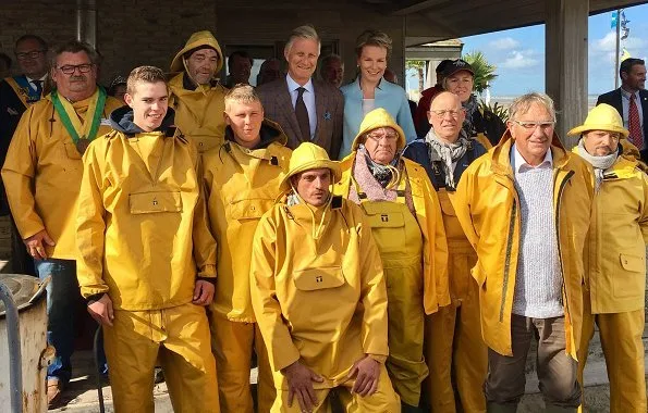 Queen Mathilde and King Philippe visited Orde van de Paardevisser in Oostduinkerke. Queen wore Dries Van Noten coat