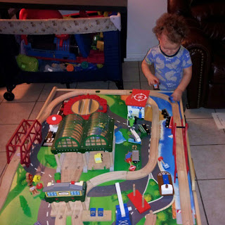 2 year old toddler playing trains